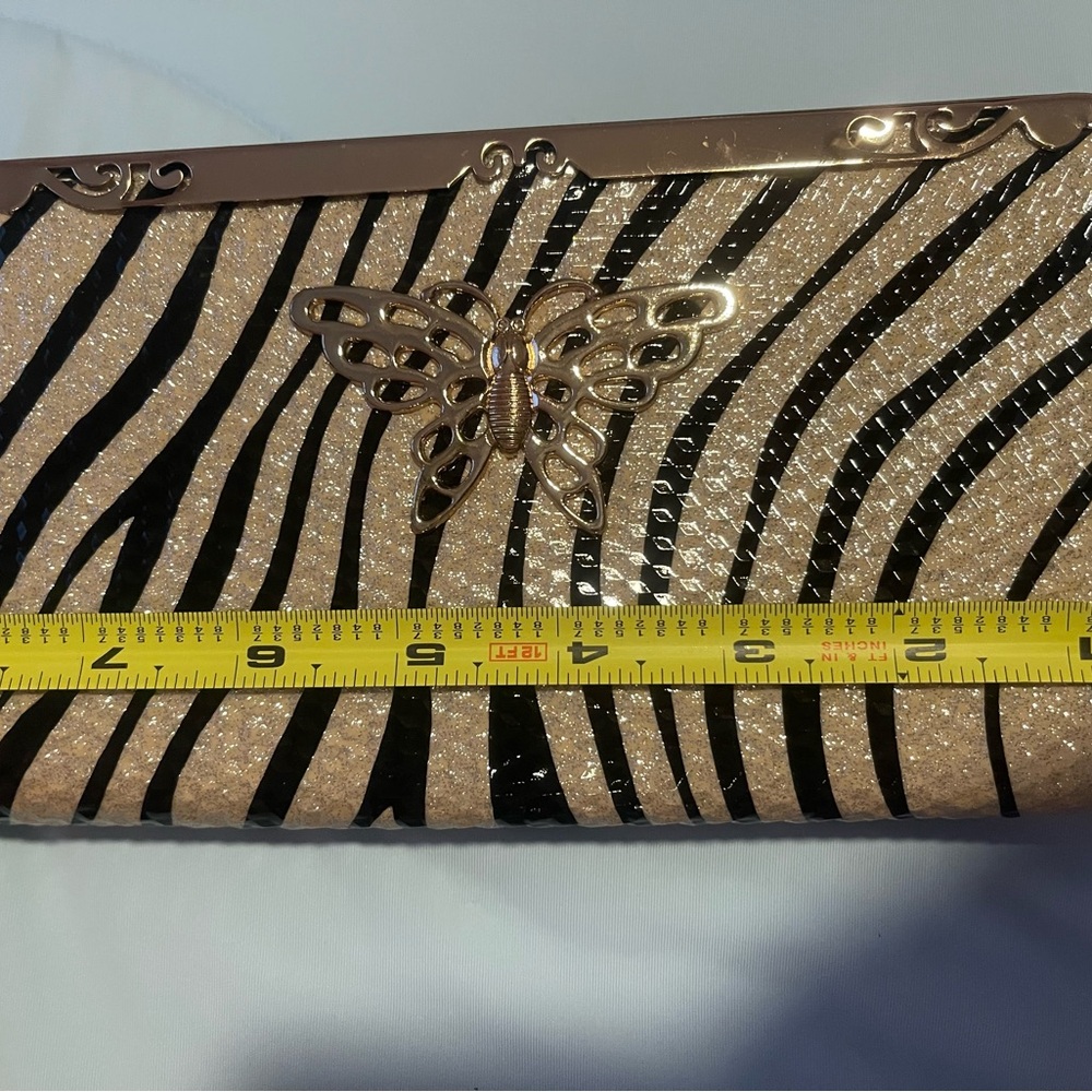 Animal print with butterfly metal details wallet. 8”x 4”x 1” - Picture 6 of 10